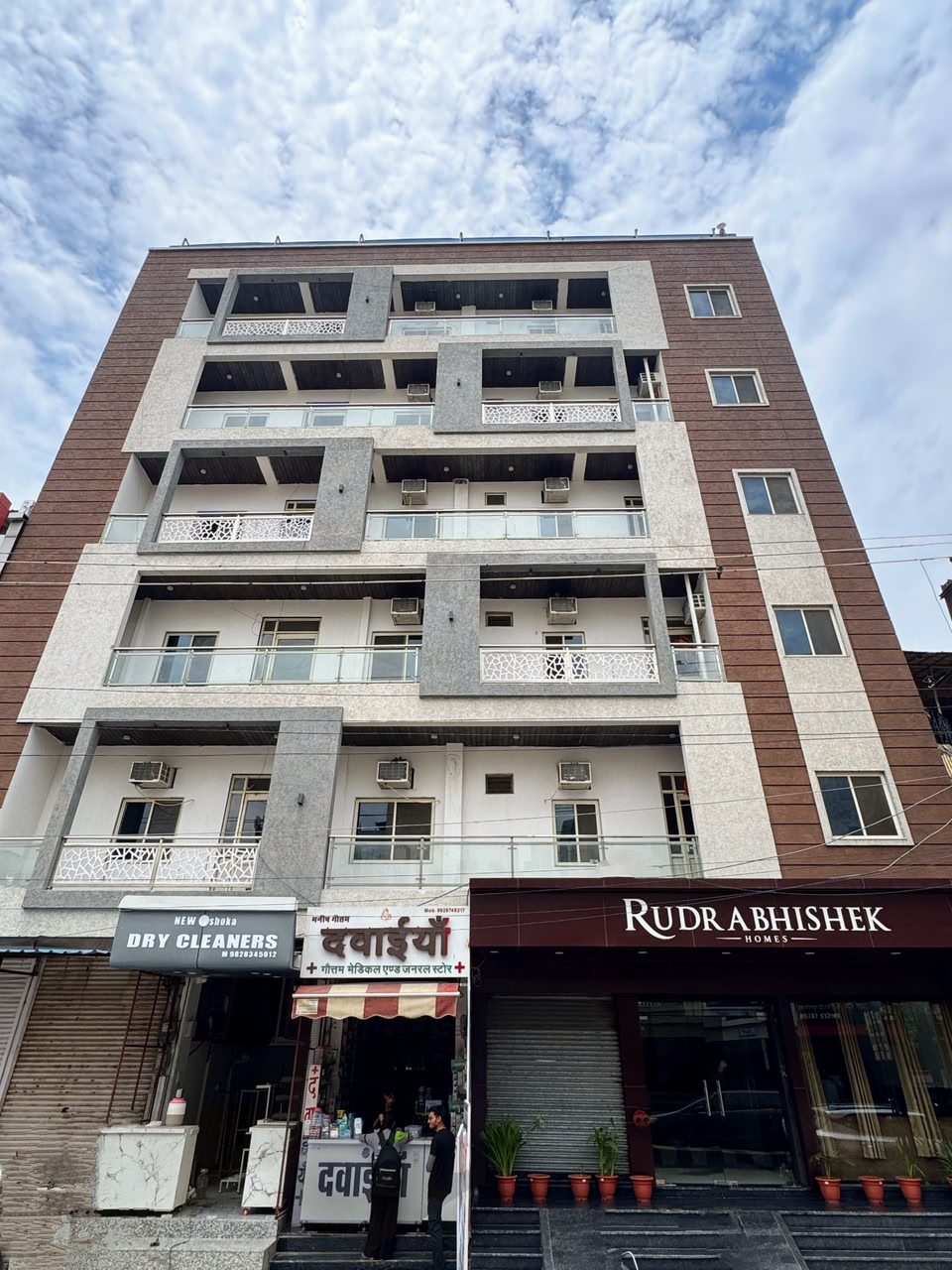 Rudrabhishek Homes — premium boys hostel building with entrance signboard, Jawahar Nagar, Kota